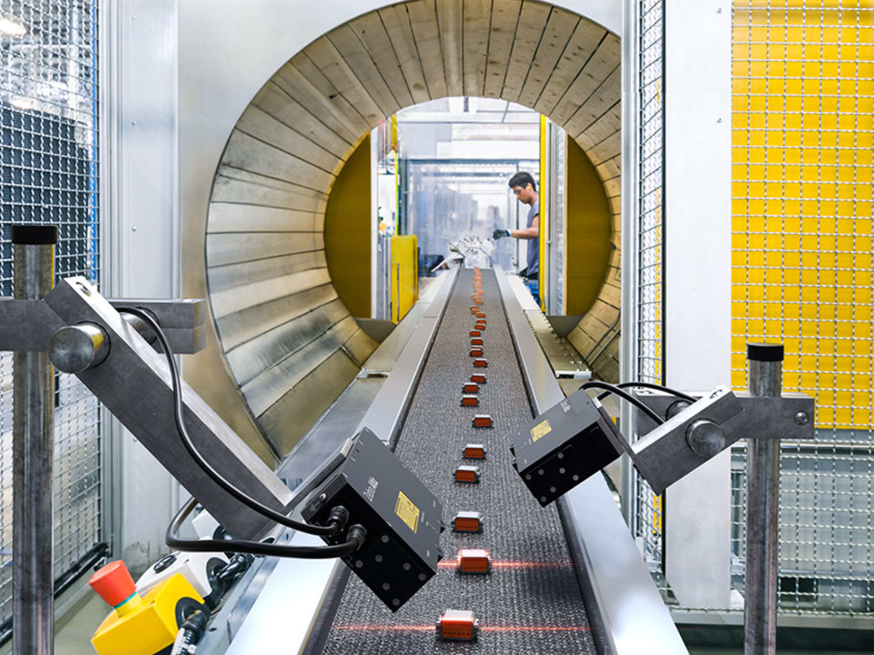 3D imaging of small brown objects on a conveyor belt using Zebra 3D sensors in an industrial facility.