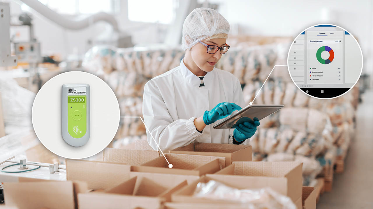 Young Caucasian employee in sterile uniform using tablet for logistic. Food factory interior.