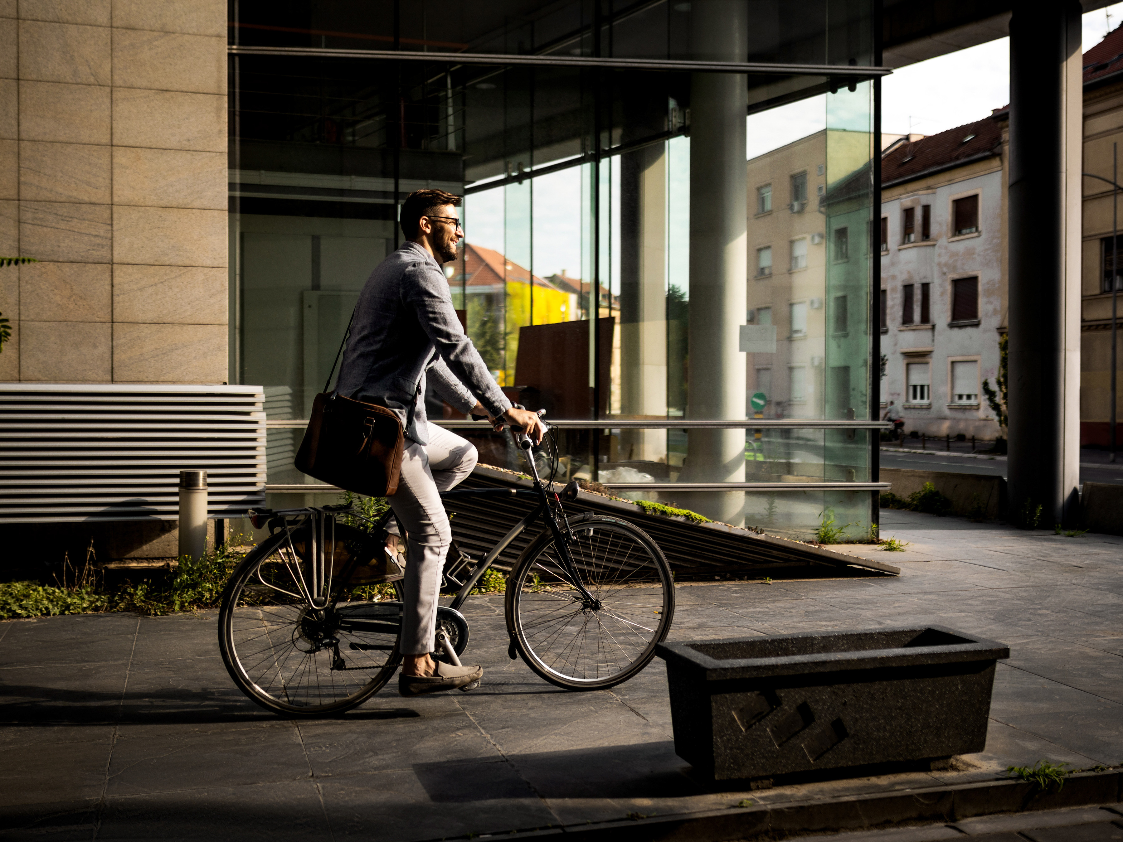 Professional riding a bicycle in a city.